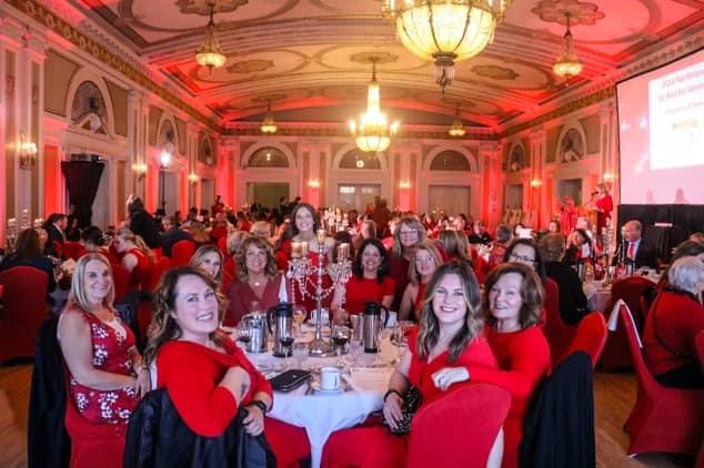 Table of guests dressed in red.